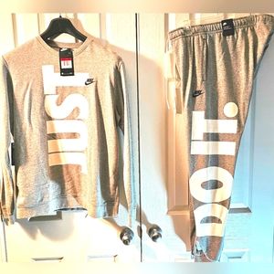 Nike heather grey with white large ( JUST DO IT) letters. Size large